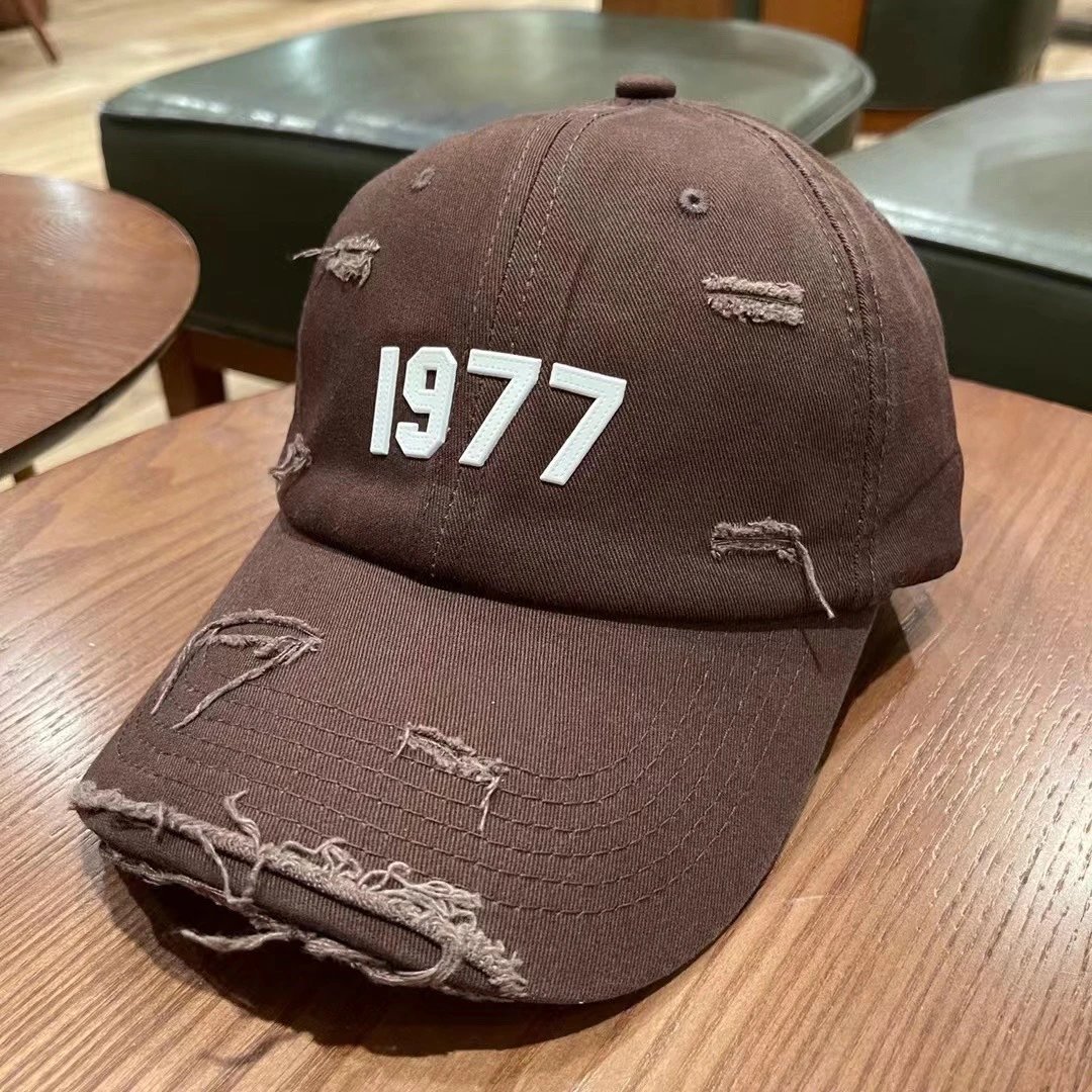 Essentials Hats Distressed Logo Baseball Cap — M06 Coffee Color