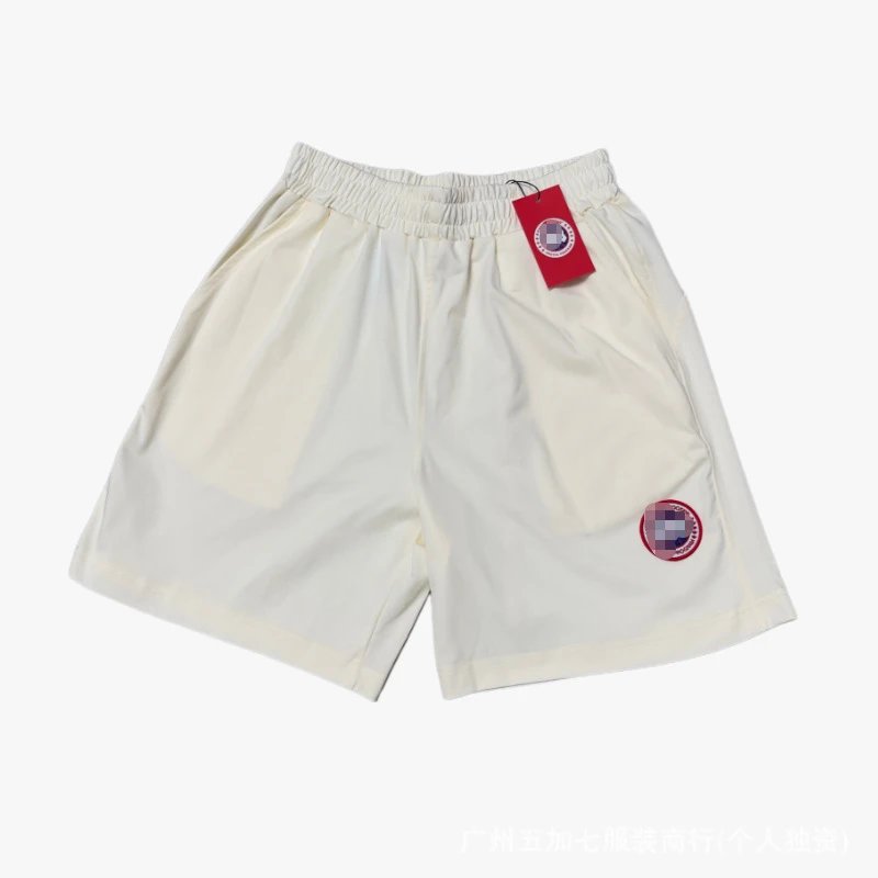 Canada Goose Matching Sets Logo-Patch T-Shirt and Shorts Set — Beige pants with a red label