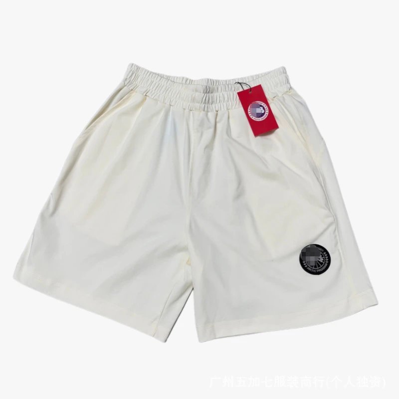Canada Goose Matching Sets Logo-Patch T-Shirt and Shorts Set — Beige pants with a black label