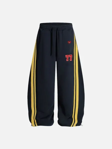 Design Wide-Leg Track Pants with Yellow Stripes and '77' Embroidery Navy Sweatpants - 1