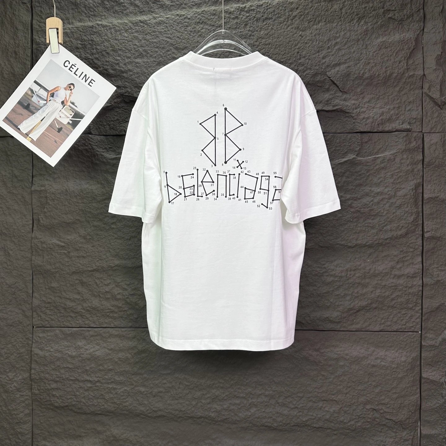 Balenciaga T-Shirt, classic white cotton tee with bold logo print, minimalist luxury streetwear style, soft breathable fabric, perfect for casual and fashion-forward looks.