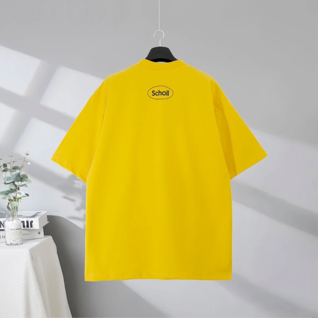 Balenciaga Scholl Yellow T-Shirt, unisex casual oversized tee, fashion streetwear style with bold logo print, soft cotton fabric, trendy summer outfit for men and women.
