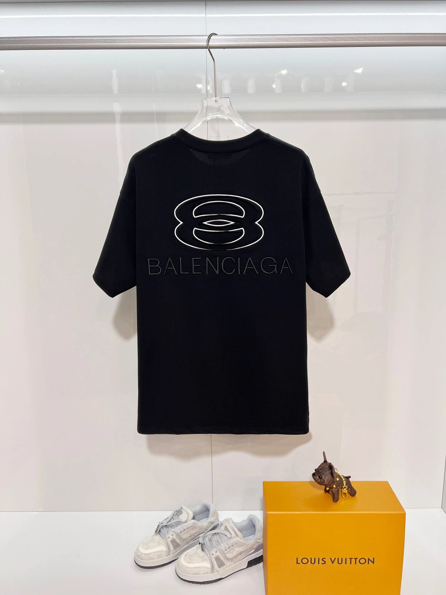 Balenciaga Black Cotton T-Shirt, minimalist design with embossed logo detail, premium fabric, casual luxury style for men and women, perfect for daily wear or street fashion.