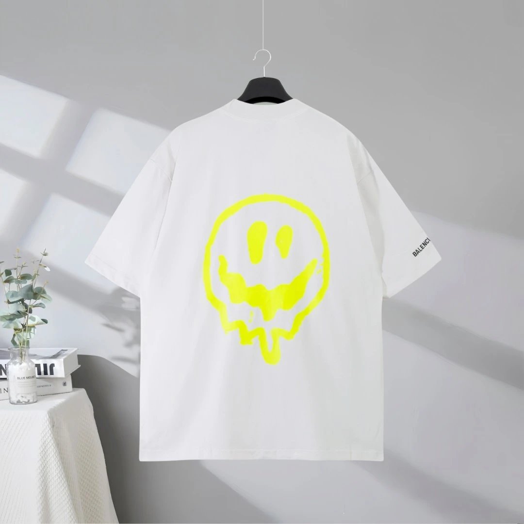 Balenciaga T-Shirt featuring a vibrant green cartoon graphic design, premium cotton fabric, oversized fit, modern streetwear style perfect for casual or fashion-forward looks.