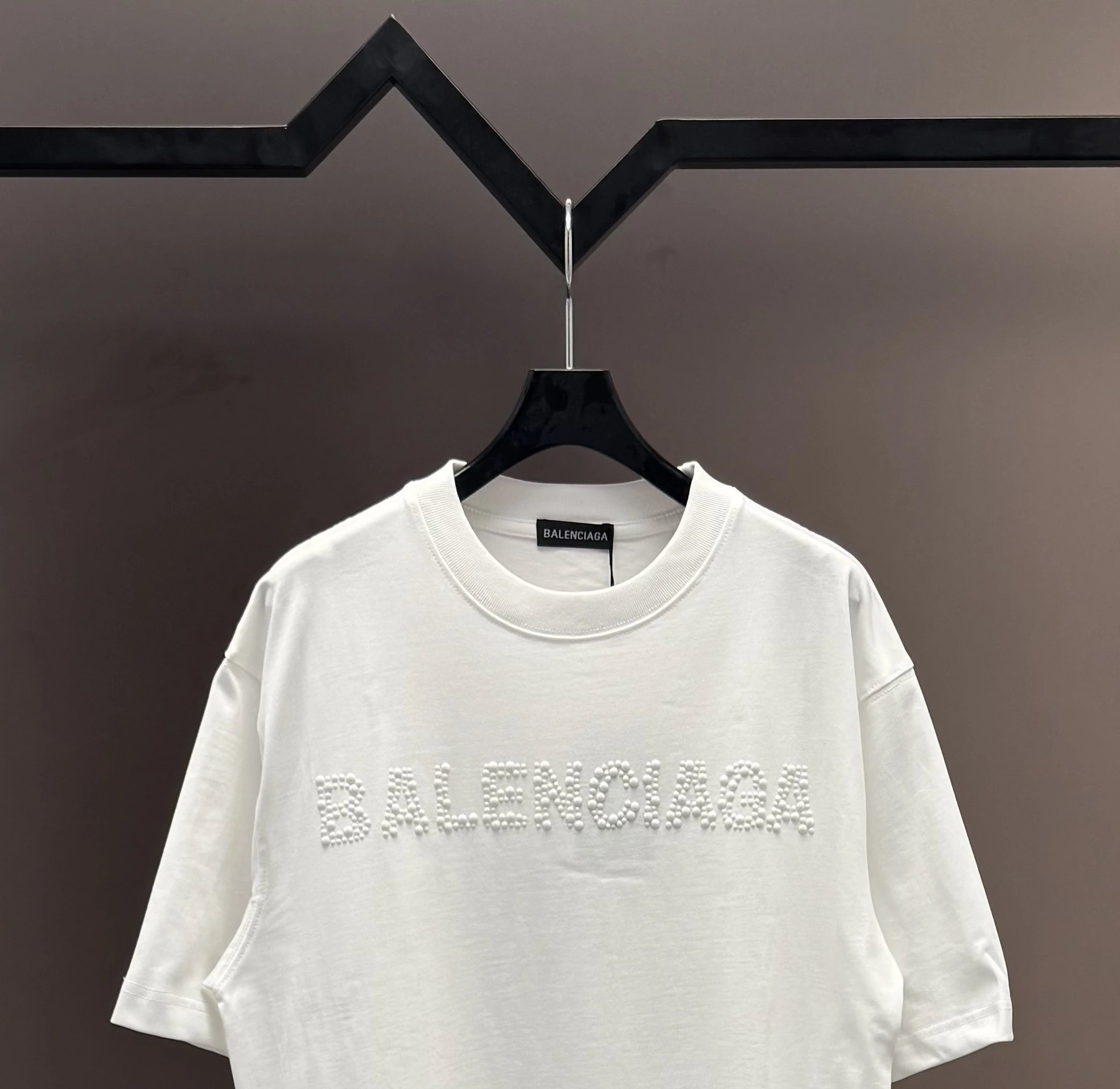 Balenciaga T-Shirt, premium cotton, minimalist white design with 3D logo embroidery, casual luxury style for men and women, perfect for street fashion and daily wear.