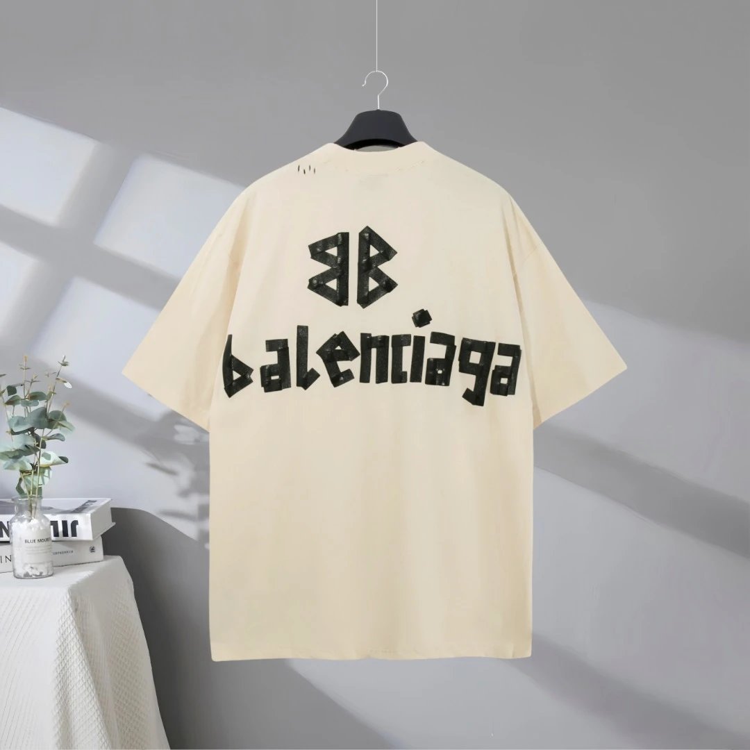 Balenciaga T-Shirt, premium cotton oversized design, minimalist beige color, bold logo print, perfect for casual streetwear and luxury fashion enthusiasts.
