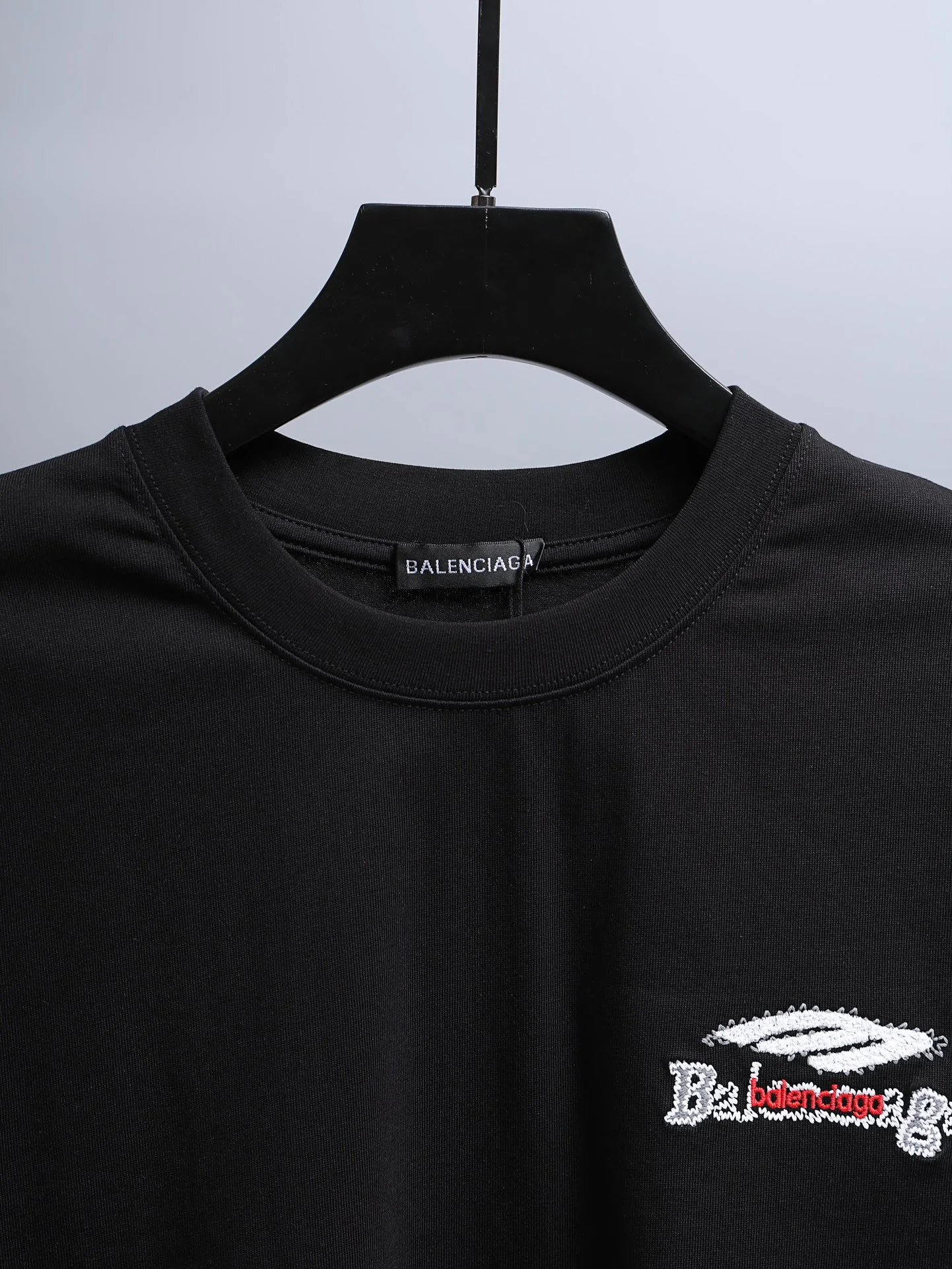 BALENCIAGA Men’s Black Cotton T-Shirt, classic crew neck design with logo print, casual luxury style for streetwear and everyday fashion.