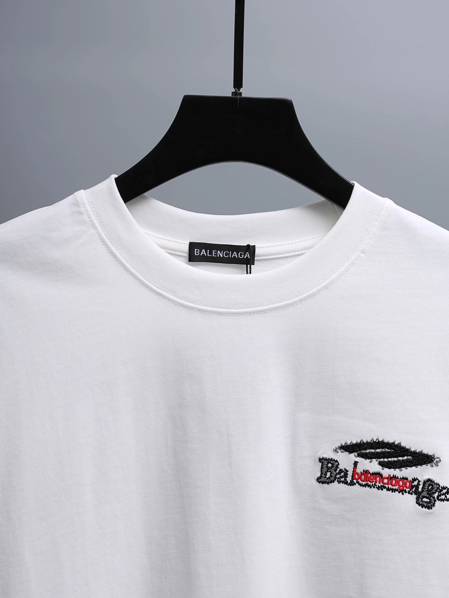 Balenciaga T-Shirt, classic white cotton design featuring minimalist logo embroidery, premium quality, unisex style for everyday casual and luxury streetwear fashion.
