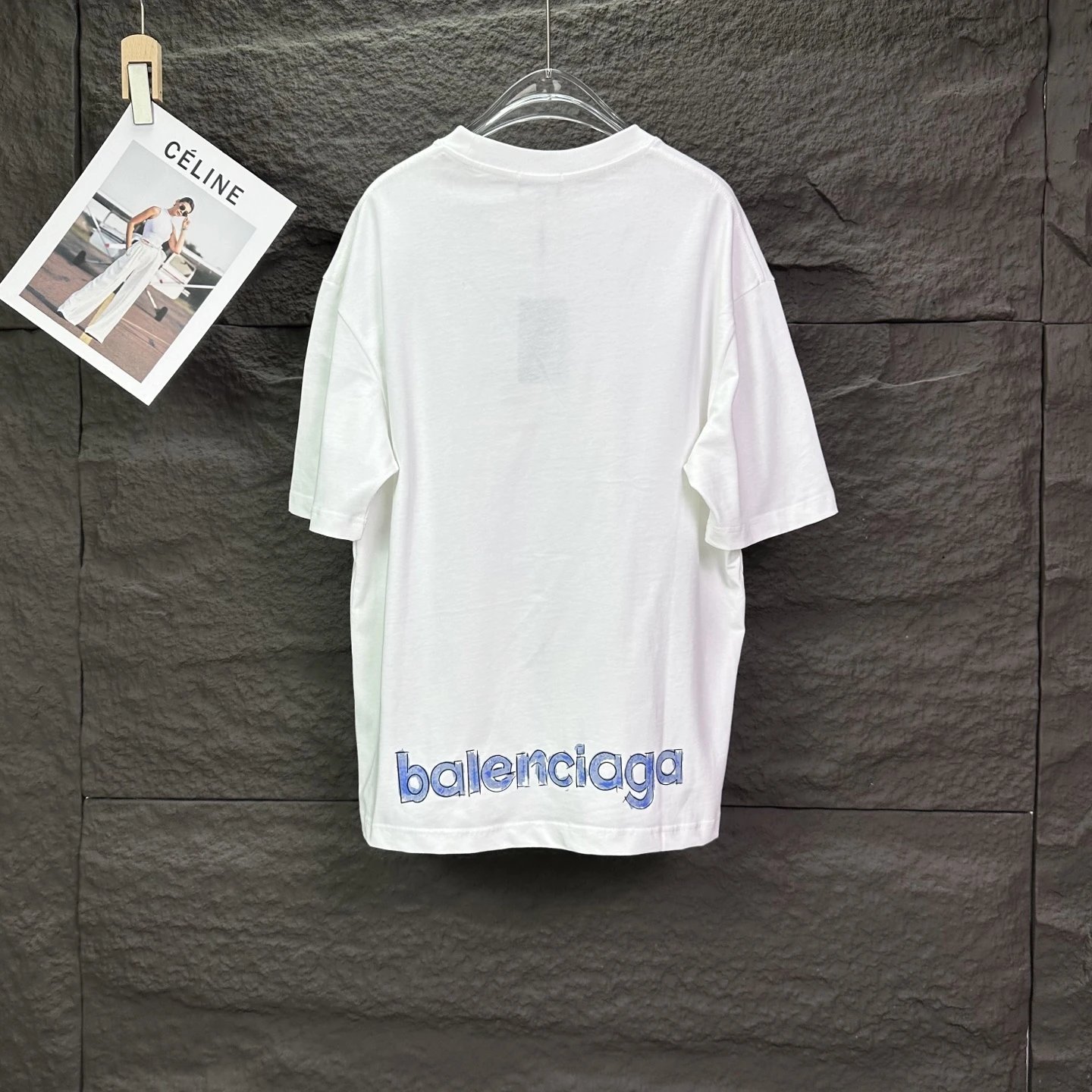 Balenciaga T-Shirt, stylish unisex white tee with blue logo print, premium cotton fabric, casual oversized fit, perfect for streetwear and fashion lovers worldwide.