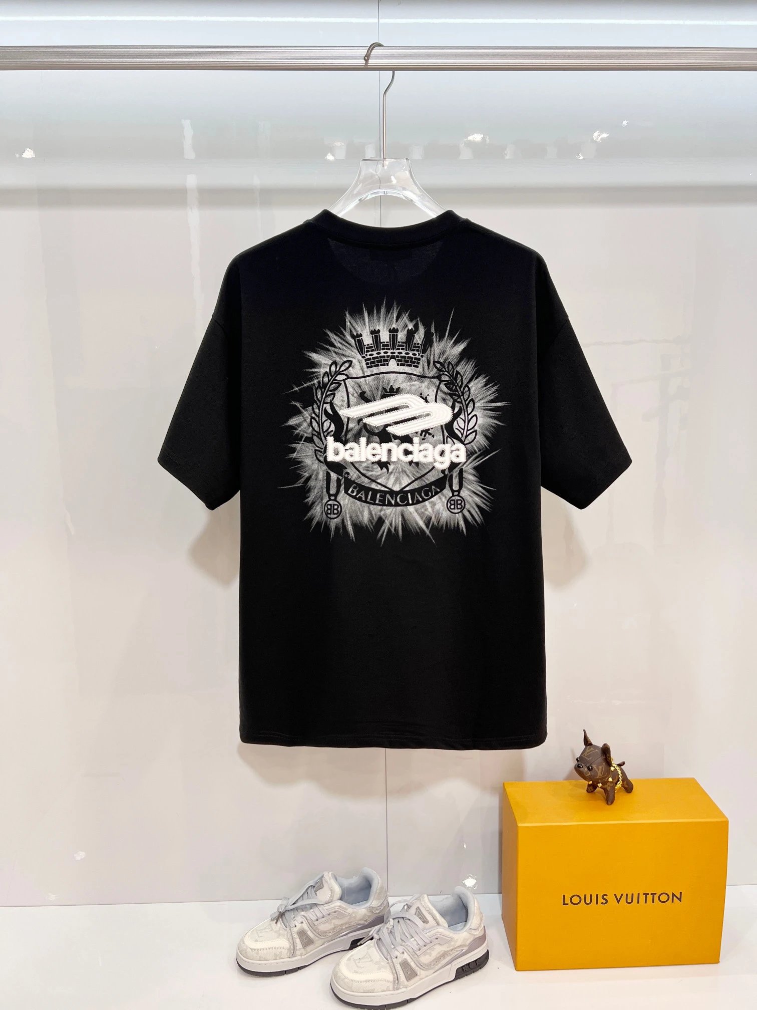 Balenciaga T-Shirt, black cotton tee with bold chest graphic logo, minimalist design, unisex streetwear fashion top for casual and luxury style.