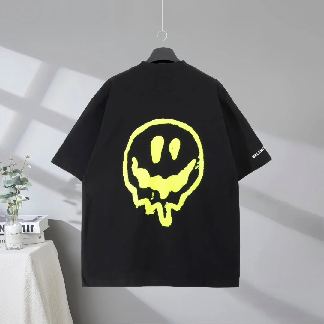 Balenciaga Men’s Graphic T-Shirt, featuring a stylish green cartoon figure print, premium cotton fabric, relaxed fit, and modern streetwear design for casual and trendy daily looks.