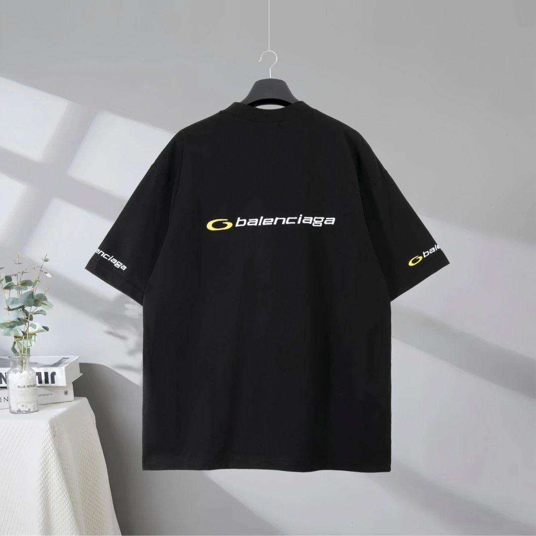 Balenciaga T-Shirt, black cotton tee with sleek yellow logo print, casual loose fit, premium streetwear style for men and women, perfect for everyday fashion and trendy outfits.