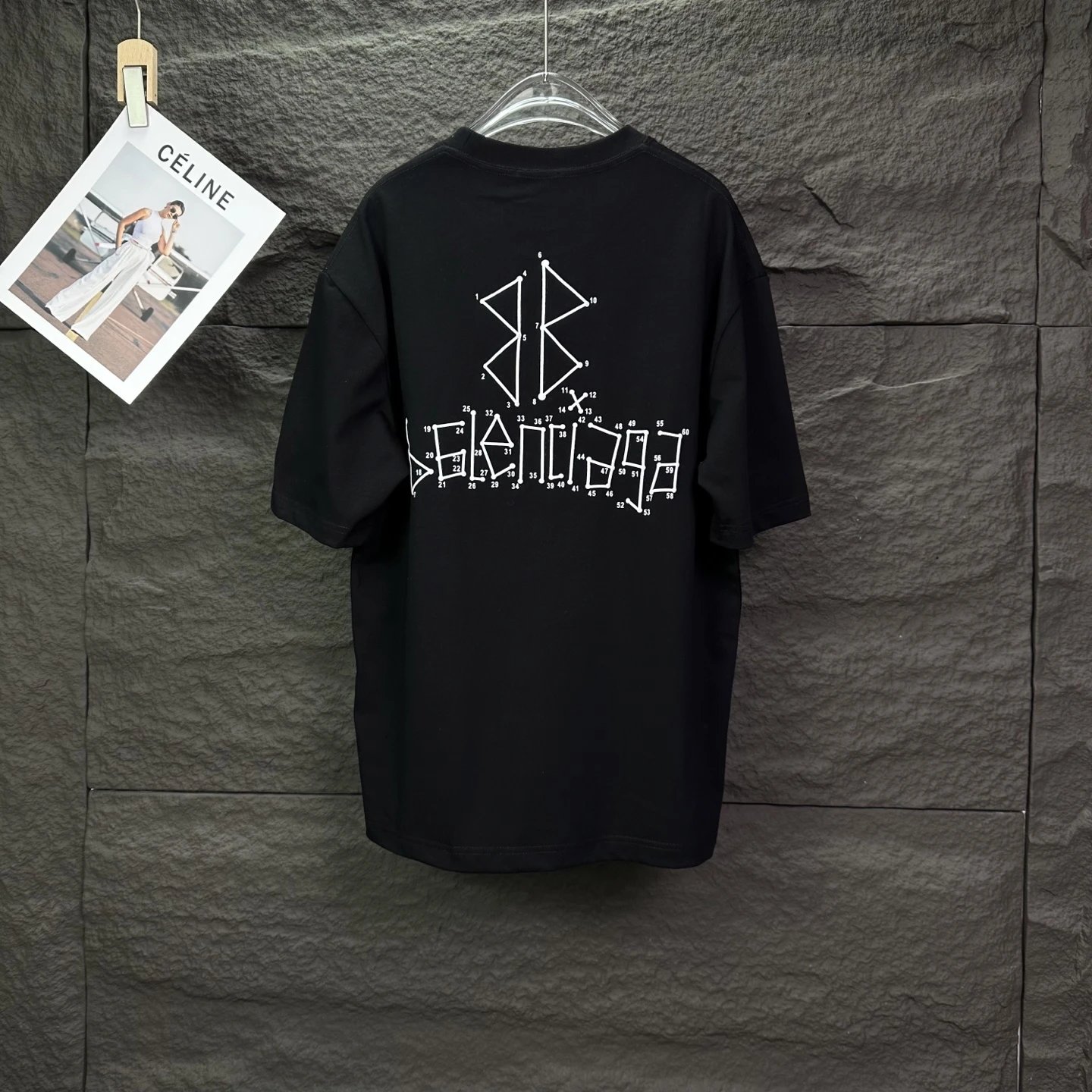 Balenciaga T-Shirt, minimalist black design with bold logo print, premium cotton fabric, unisex casual style, perfect for streetwear and high-fashion lovers.
