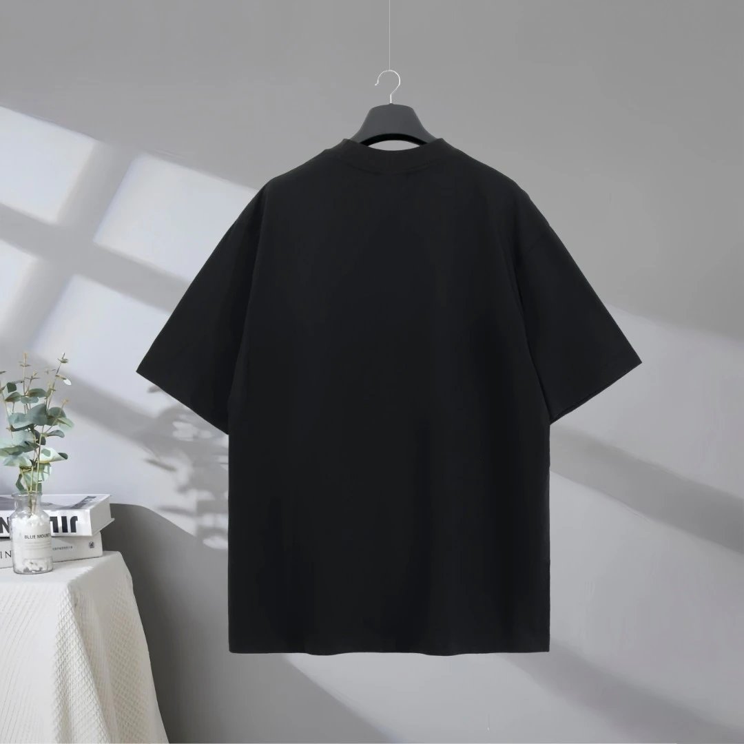 Balenciaga T-Shirt, black cotton tee with bold curved logo print, minimalist streetwear style, oversized fit, perfect for casual or urban fashion lovers.