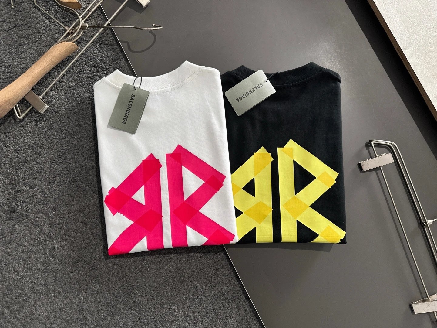 Balenciaga T-Shirt, black cotton top with bold yellow logo print, casual designer streetwear, unisex short sleeve fashion tee for daily style and comfort.