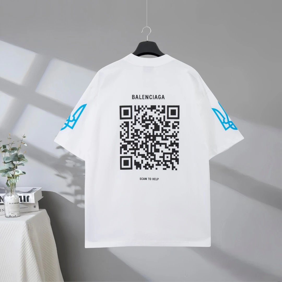 Balenciaga unisex white T-shirt featuring Ukraine flag print, bold text design, and minimalist sleeve graphics; premium cotton for comfort and streetwear style.