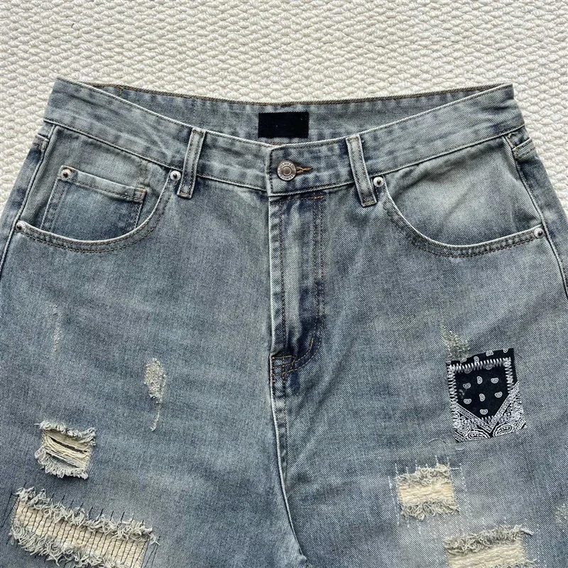 SS25 Balenciaga Heavily Ripped Denim Jeans