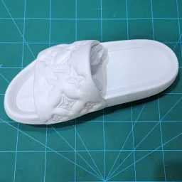 thumbnail for Embossed logo slippers (REAL on the right and GZ on the left)