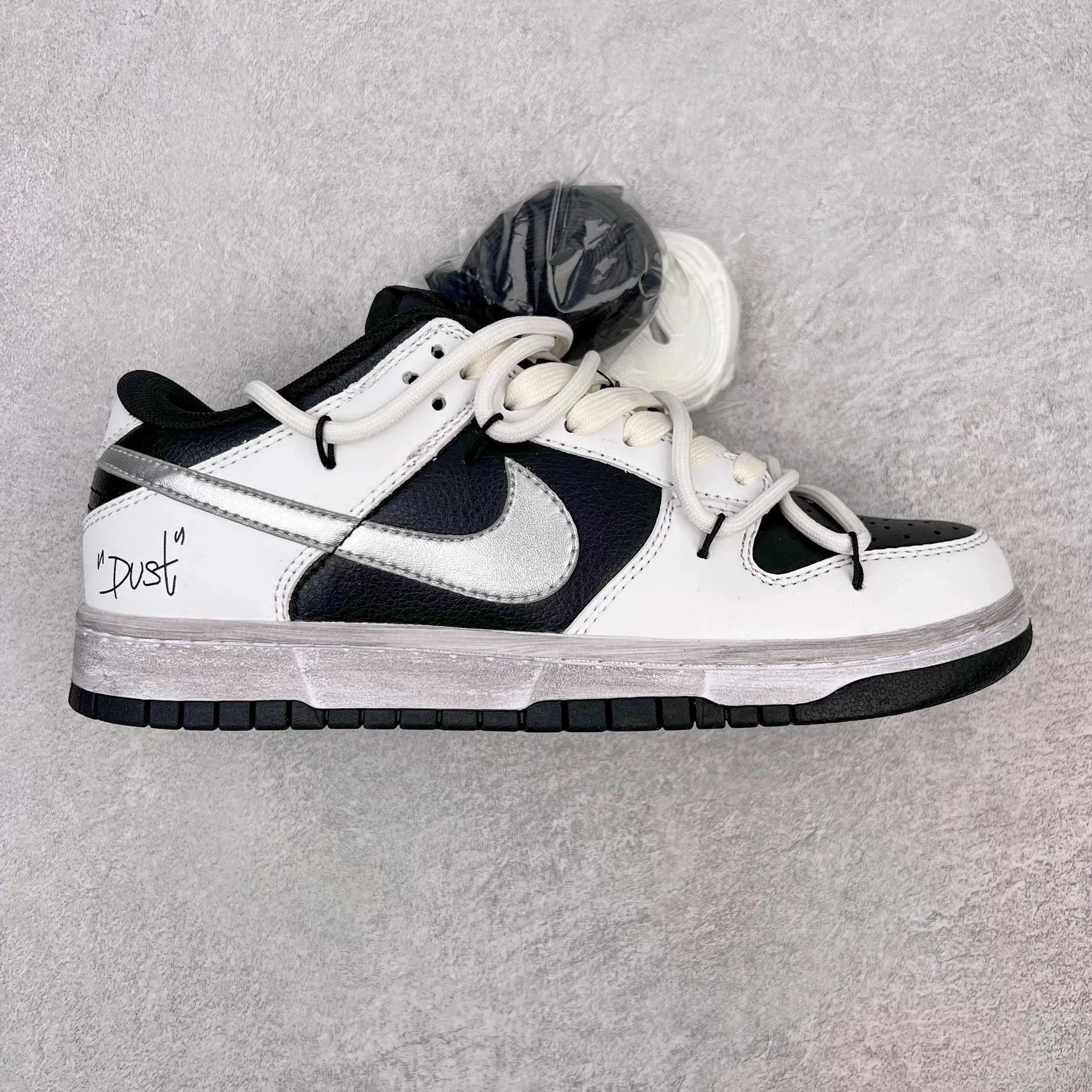 Nike Sneakers Dunk Low Retro Deconstructed Lace Design — Black, silver, and white hook