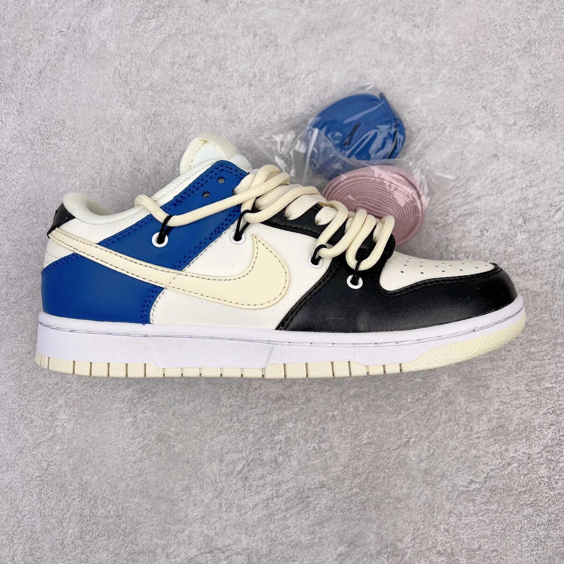 Nike Sneakers Dunk Low Retro Deconstructed Lace Design — Black, white, and blue 1