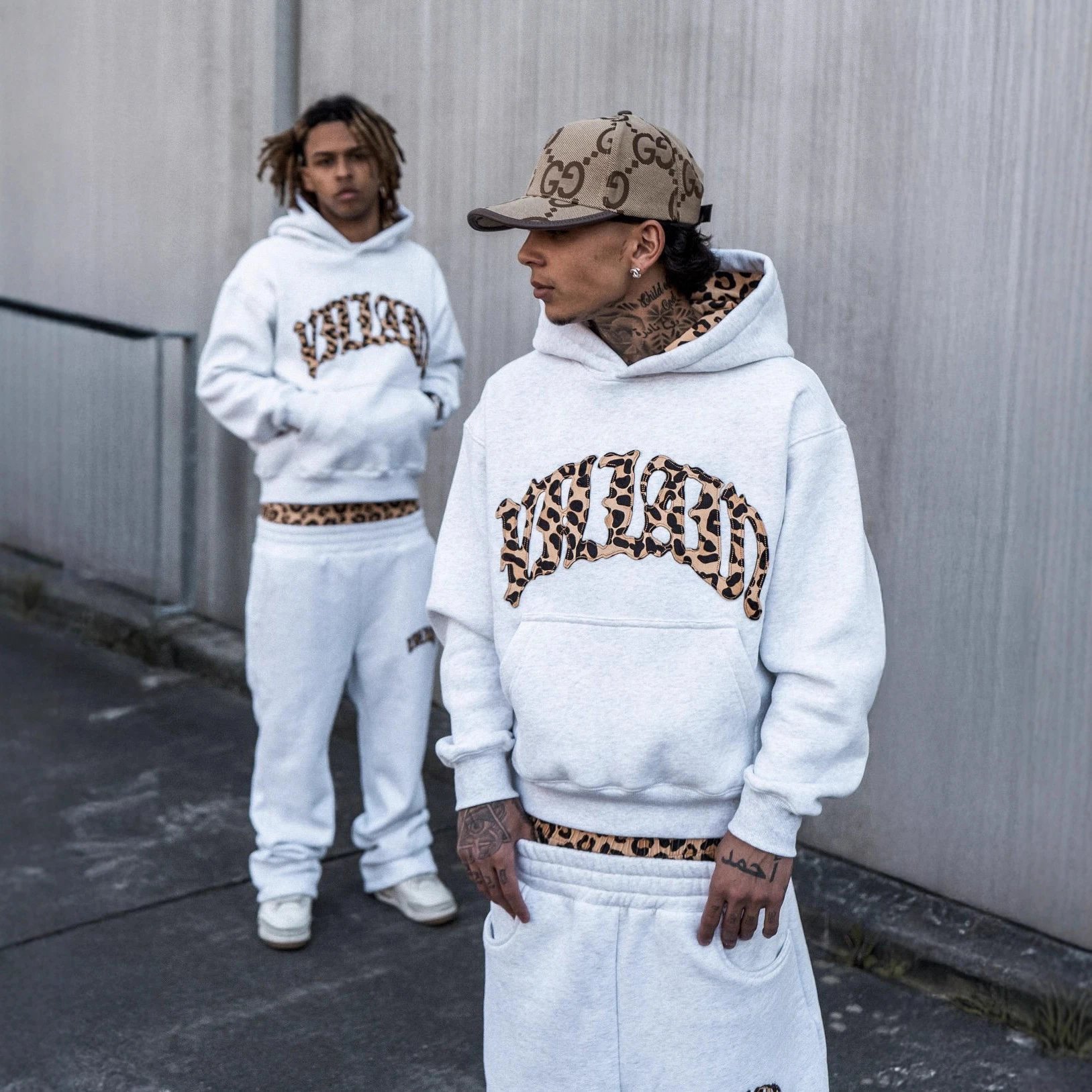 White Pullover Hoodie With Leopard Print Lining And Arched Graphic
