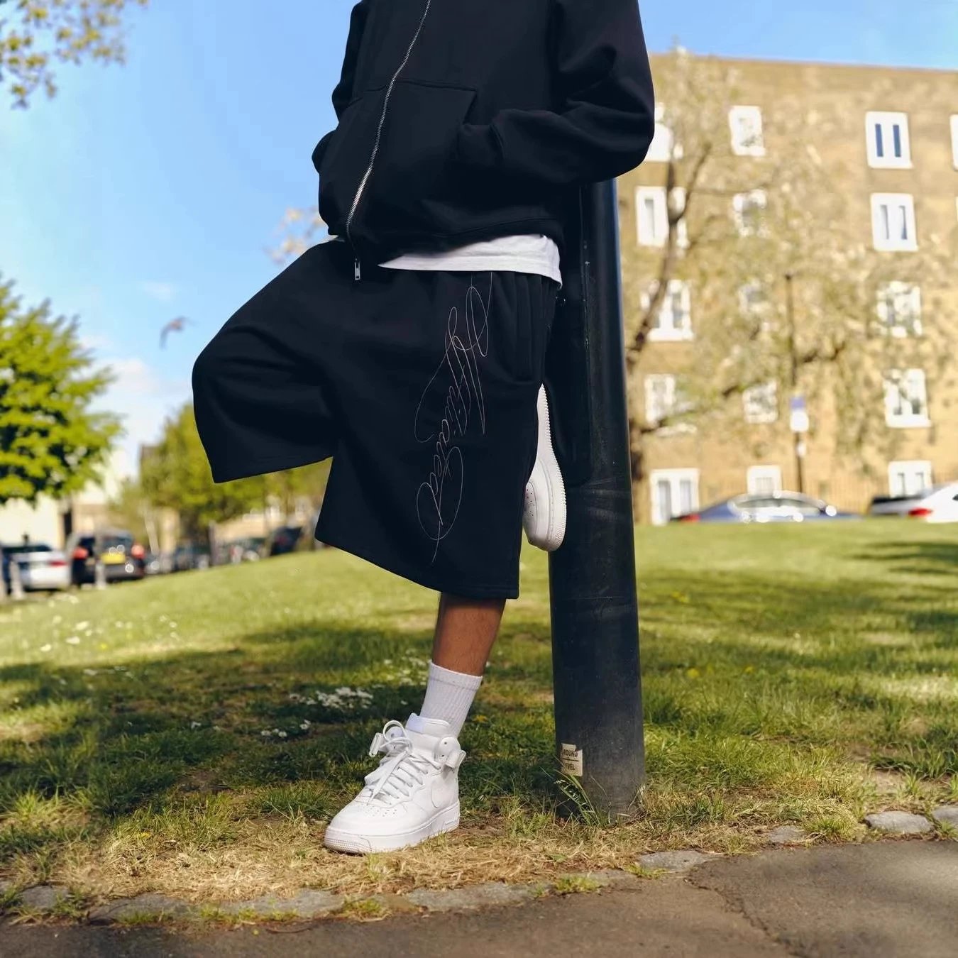 G.arms Oversized Sweatshorts with Vertical Script Embroidery