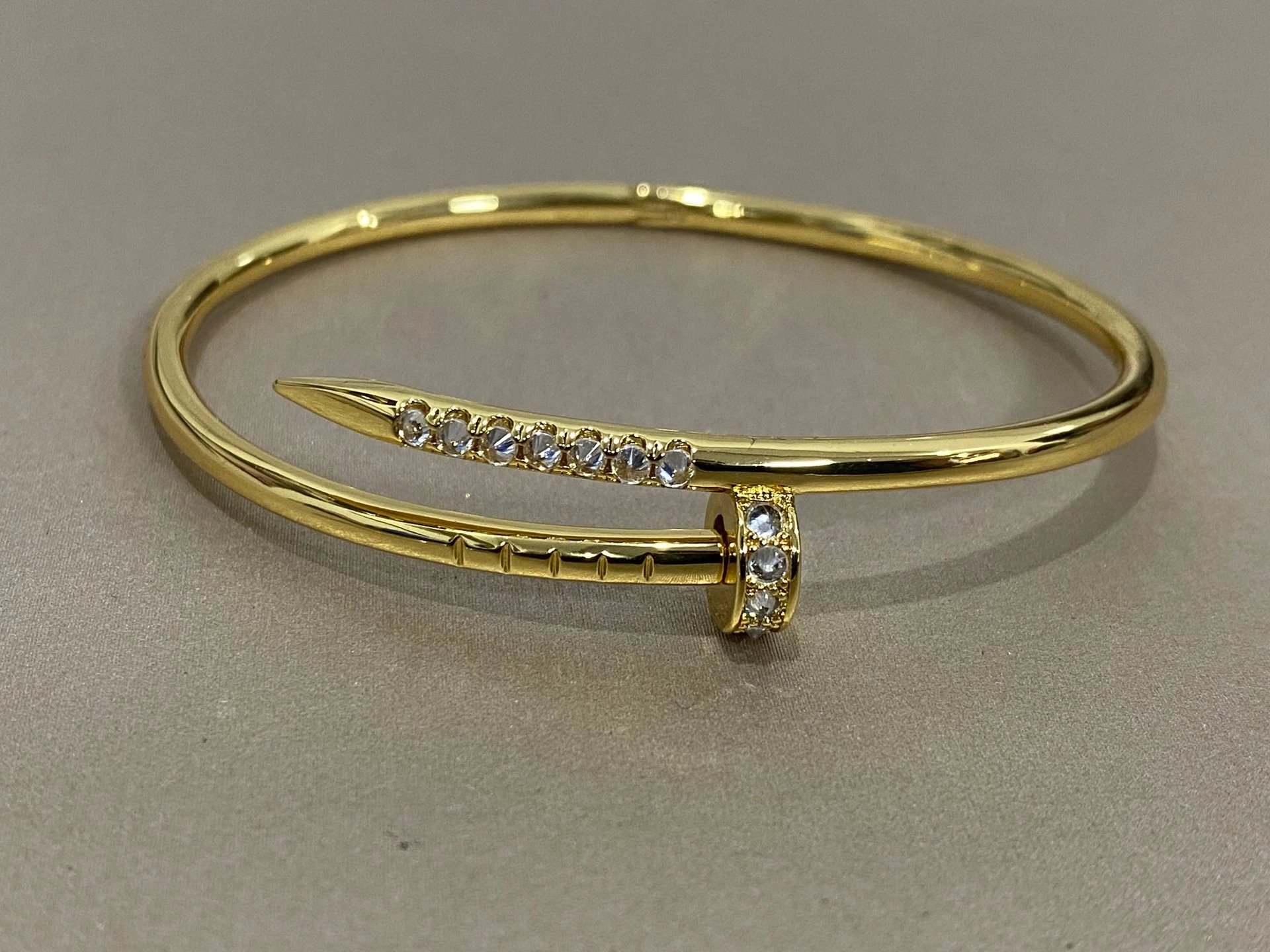 Gold Tone Nail Head Hinged Bangle Bracelet with Crystals