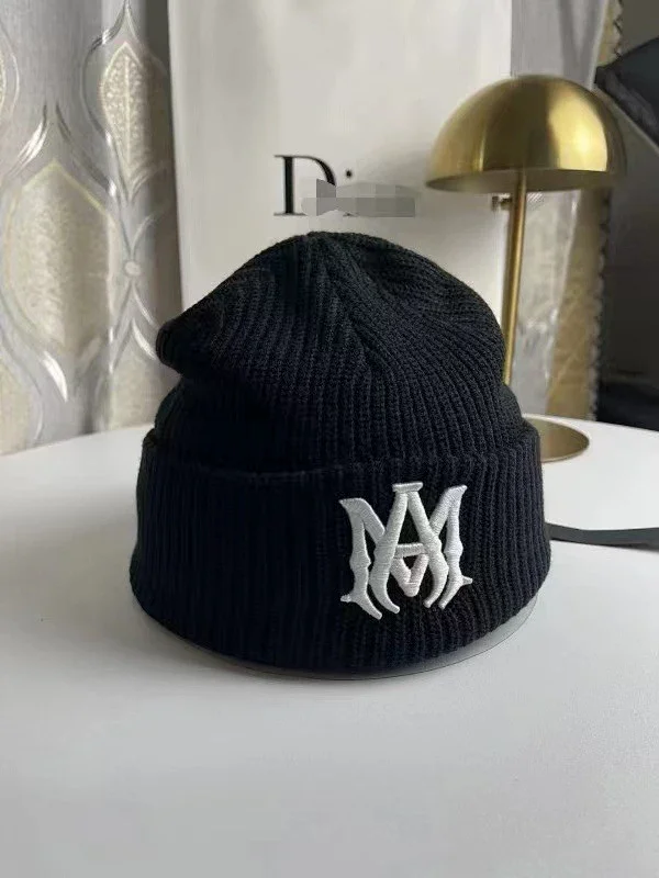 AMIRI Hats Ribbed cuffed knit beanie with embroidered three-star design product detail image 13