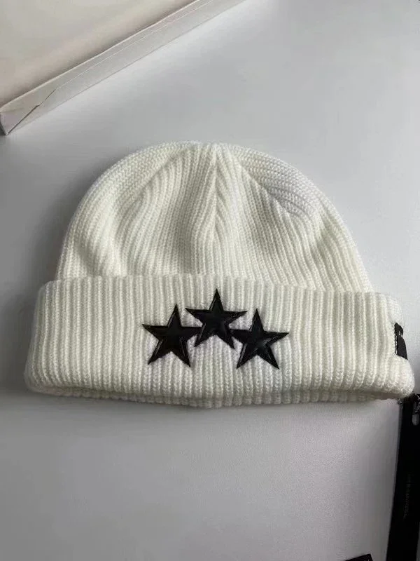 AMIRI Hats Ribbed cuffed knit beanie with embroidered three-star design product detail image 11