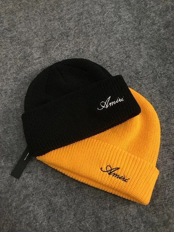 AMIRI Hats Ribbed cuffed knit beanie with embroidered three-star design product detail image 1