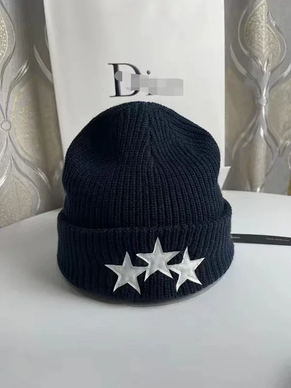 AMIRI Hats Ribbed cuffed knit beanie with embroidered three-star design product detail image 7