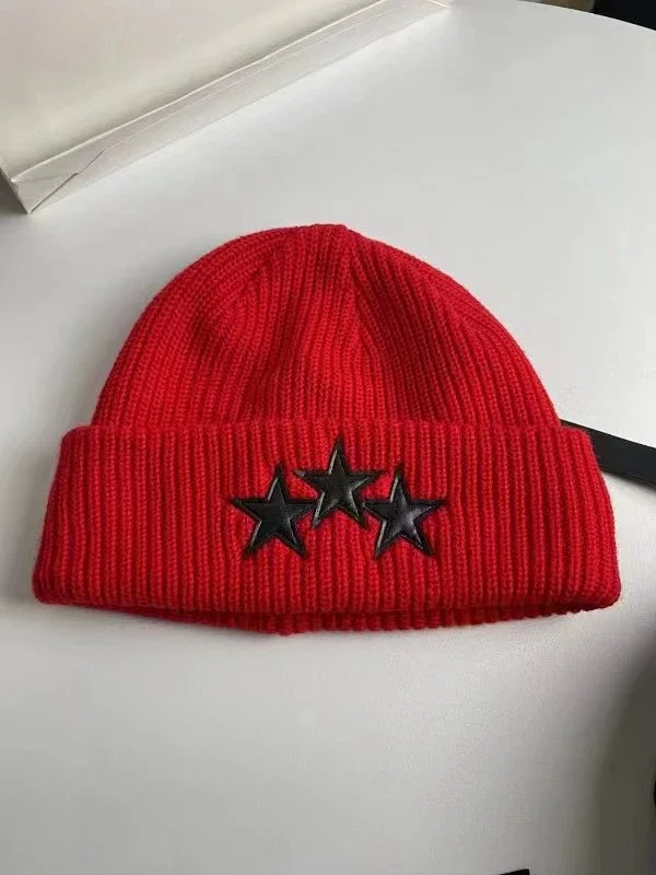 AMIRI Hats Ribbed cuffed knit beanie with embroidered three-star design product detail image 8