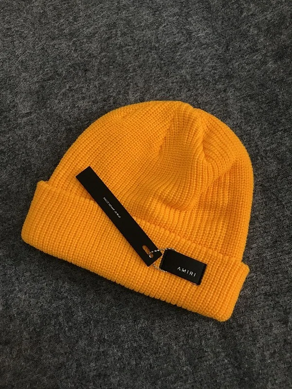 AMIRI Hats Ribbed cuffed knit beanie with embroidered three-star design product detail image 5