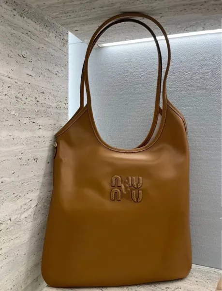 Miu Miu Logo-Embossed Distressed Brown Tote Bag - 25