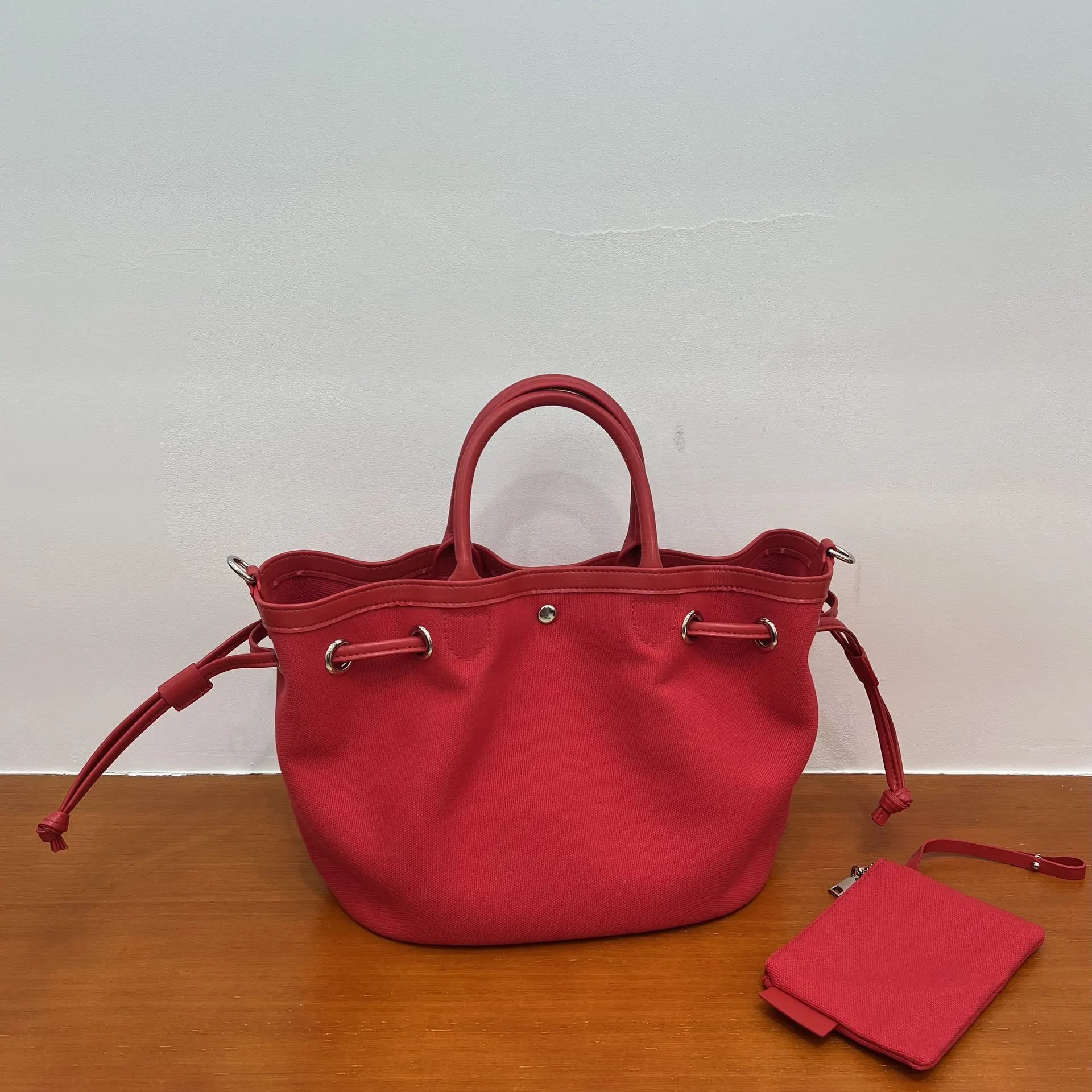 Design Canvas Bucket Bag in Red with Drawstring Closure and Detachable Pouch