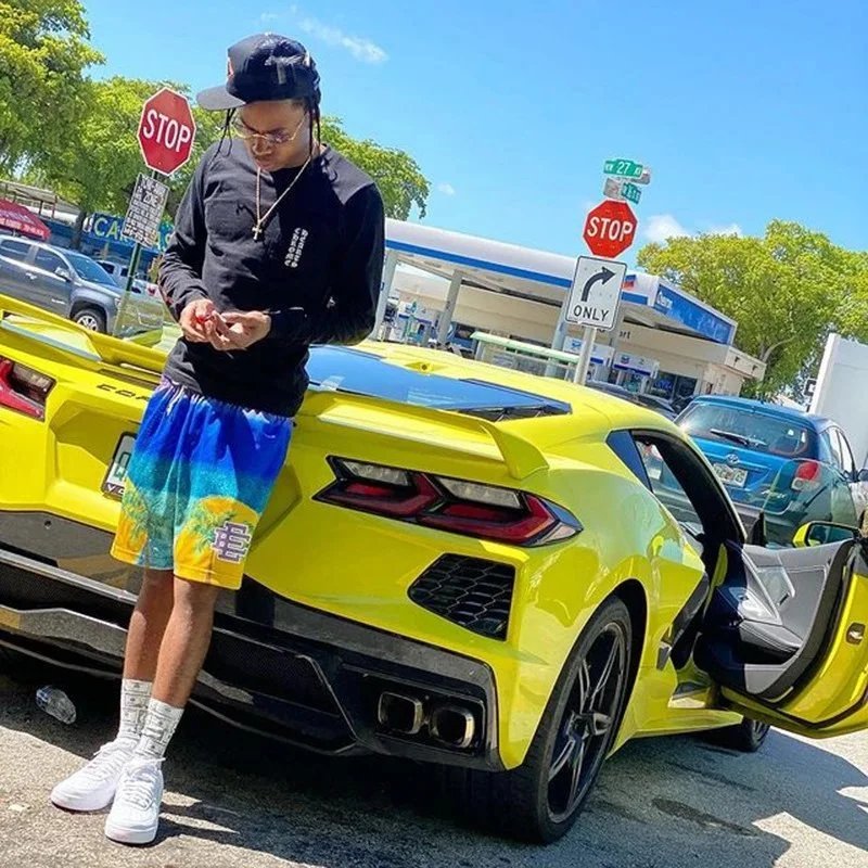 Black Long Sleeve Top with Blue Shorts and White Sneakers