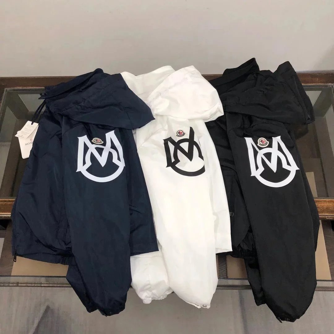Moncler Black, White, and Navy Hooded Windbreaker Jackets