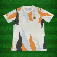 24/25 Real Madrid training kit in orange and white