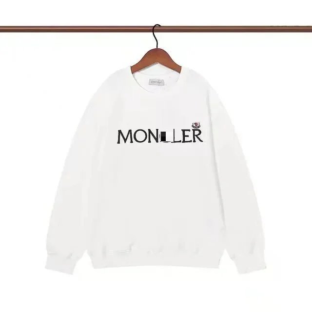 Plain white top with a single letter