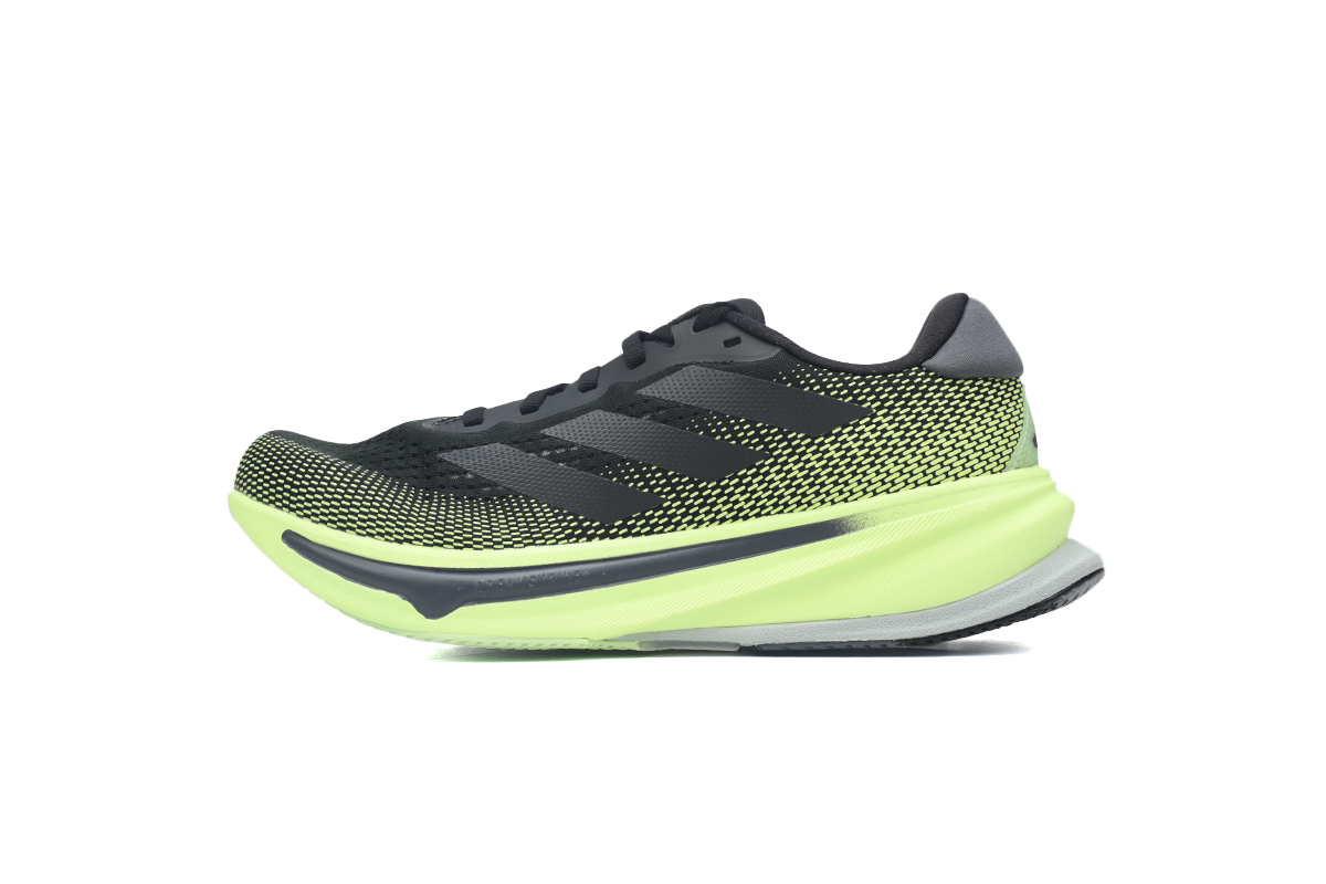 Black and green running shoes