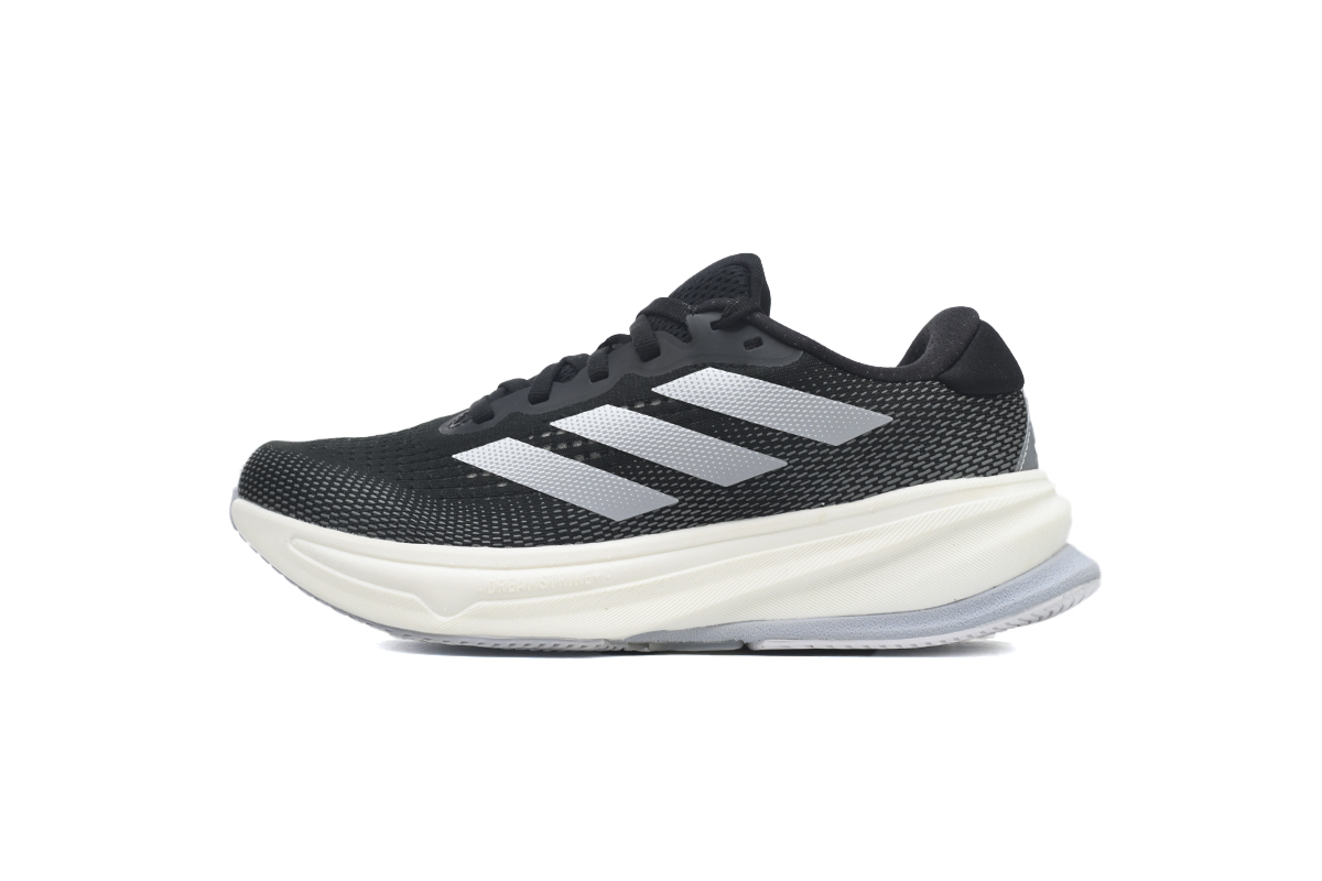 Running shoes in black, silver, and white