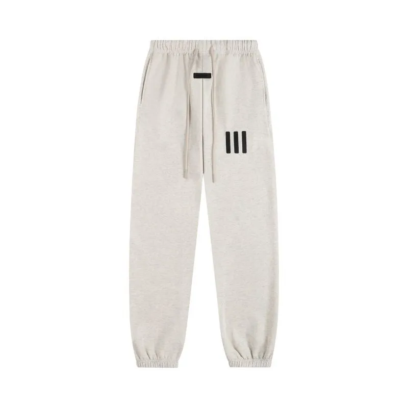 ESSENTIALS: Joggers with Small Lettering Print