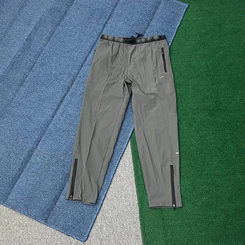 Nike Trousers Lightweight zip-ankle track — Dark gray