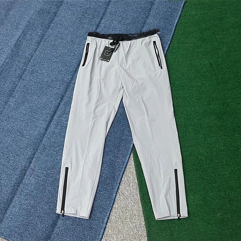 Nike Trousers Lightweight zip-ankle track — Light gray