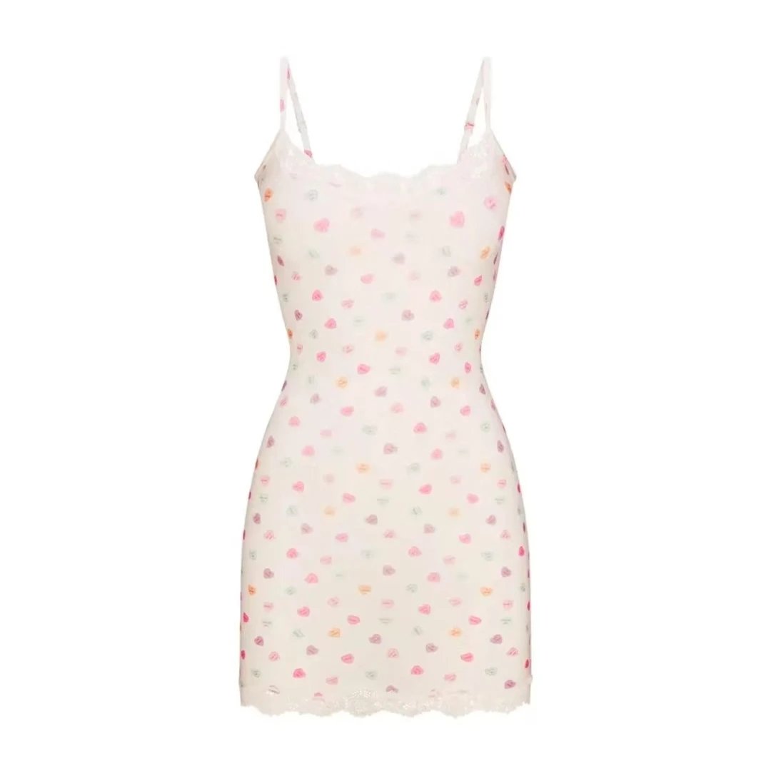 White Lace-Trimmed Bodycon Dress and Black Leather Corset-Style Mini Dress