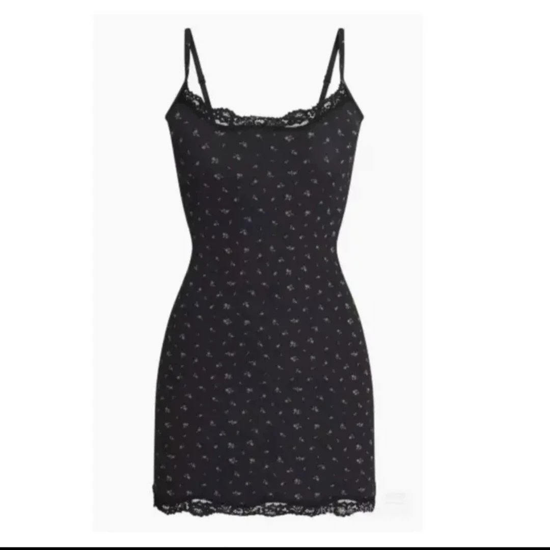 White Lace-Trimmed Bodycon Dress and Black Leather Corset-Style Mini Dress