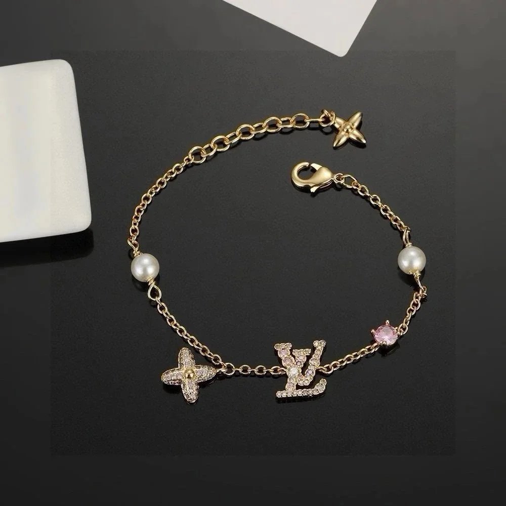 Louis Vuitton Monogram World Tour Gold Pearl Flower Charm Bracelet