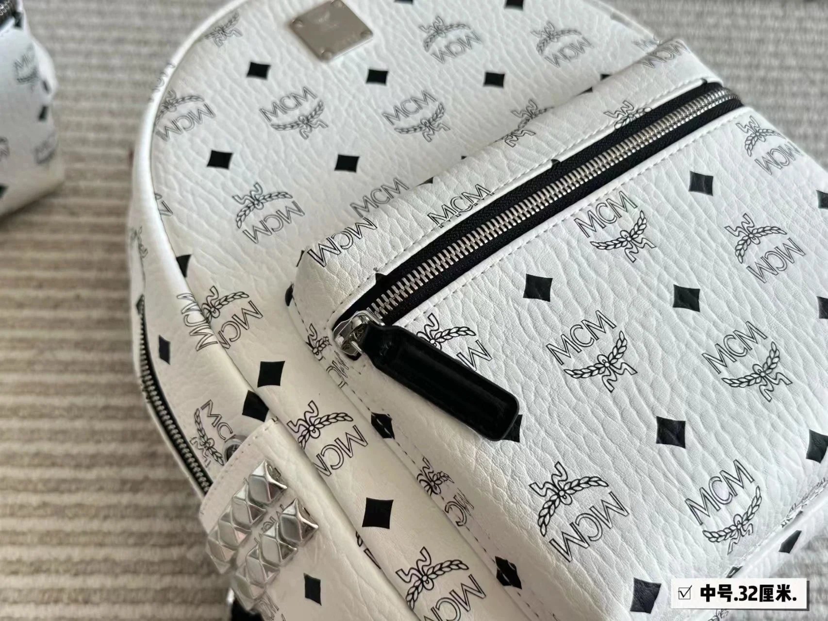 MCM Backpacks Visetos logo-print studded backpack image 8
