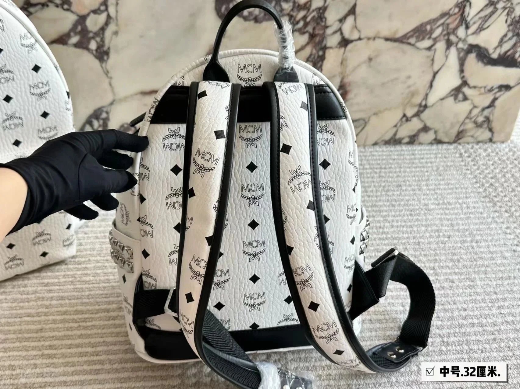 MCM Backpacks Visetos logo-print studded backpack image 11