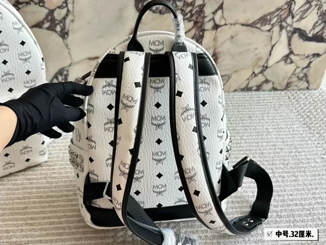MCM Backpacks Visetos logo-print studded backpack product detail image 11